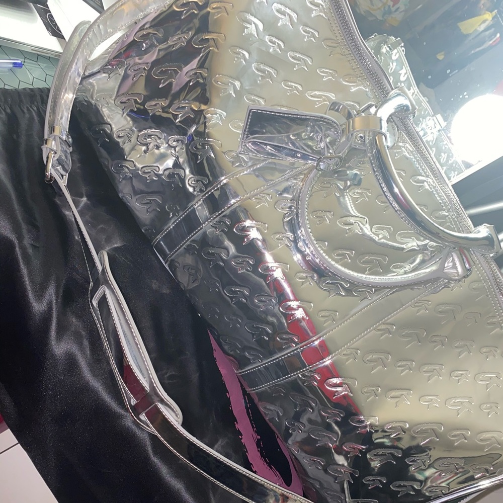 Glamaholic lifestyle silver metallic duffel bag.